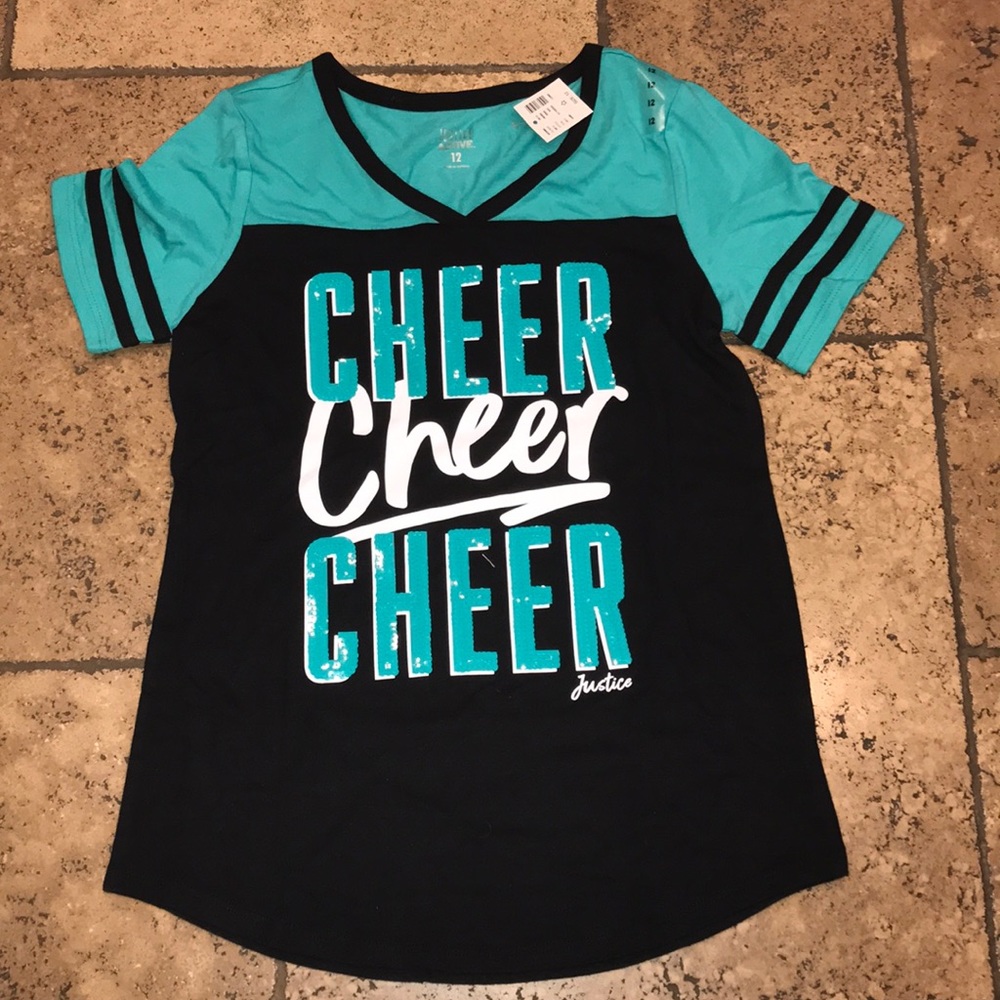 Justice blue and black cheer shirt.